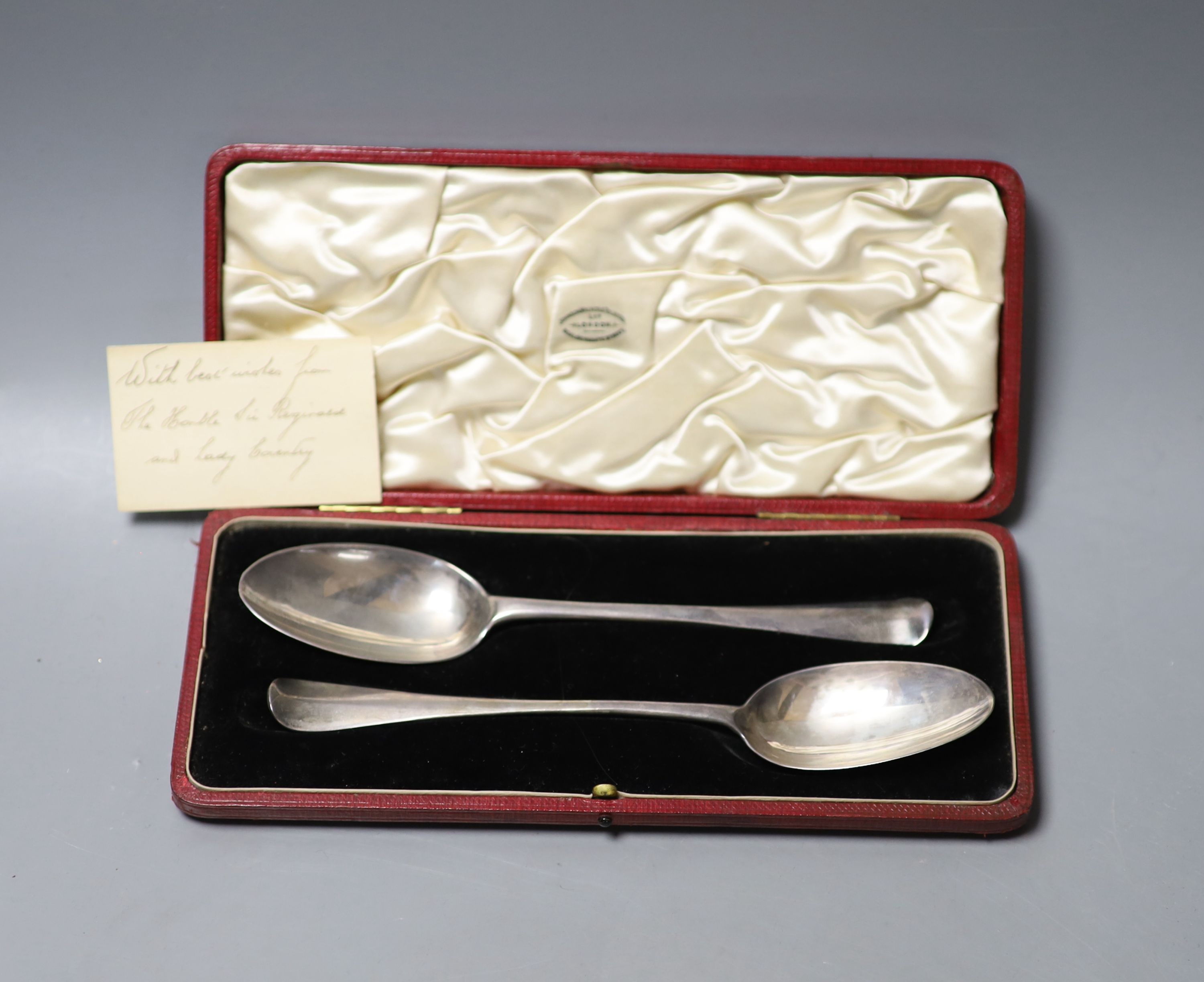 A cased matched pair of 18th century silver Hanovarian rat tail pattern tablespoons, one date for London, 1720, (marks pinched and rubbed), 19.5cm, 95 grams.